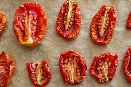 Dried sliced tomatoes on plate. Top view. close