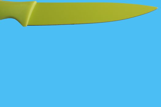 green isolated knife with blue background
