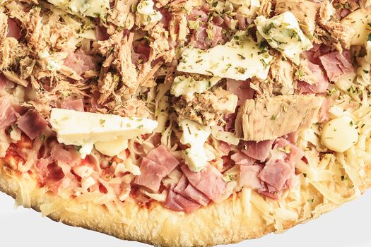 Pizza of ham, tuna and roquefort cheese