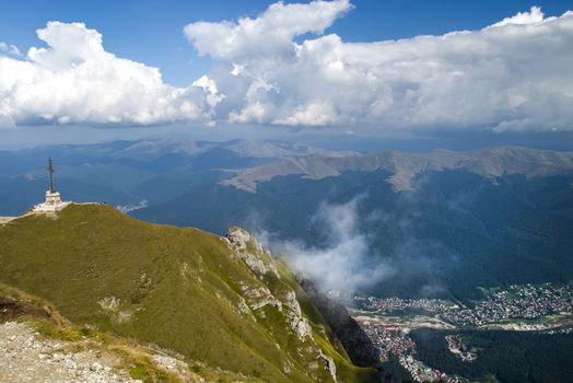Aerial view of mountain resort from the top: Heroes Cross and Busteni resort in Bucegi Mountains, Romania