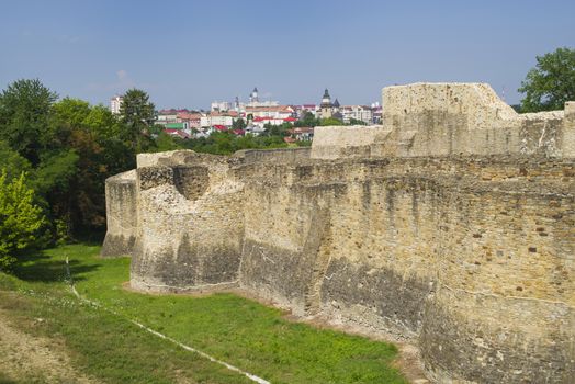 Medieval ruins of Suceava fortress and city behind