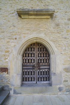 Stone wall with barred wooden door, Dragomirna Monastery