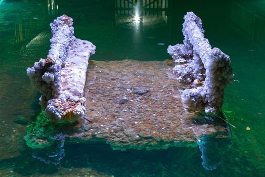 Crystallized Salt bench in Underground lake. Lake is located at a depth of 35 meters underground, dug manually by miners.