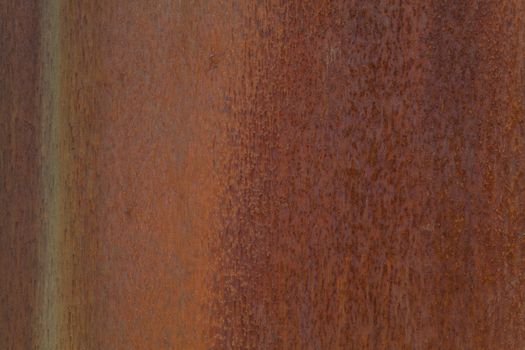 Closeup photo of a rusting metal surface.