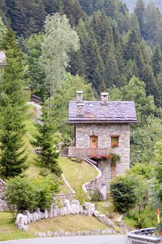 Traditional stone chalet in a dolomite pass in Italy