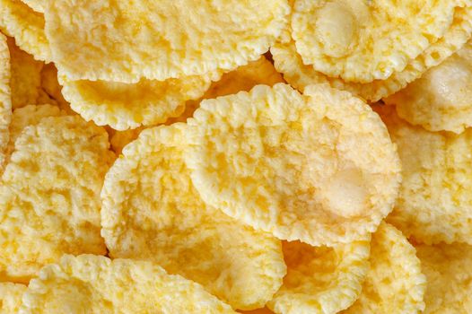 small heap of cornflakes, extreme closeup, macro, suitable as background
