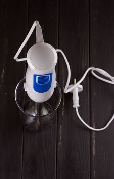 hand blender electric mixer on the black background