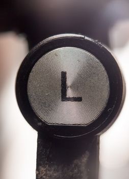 close up of left headphone letter L; UK