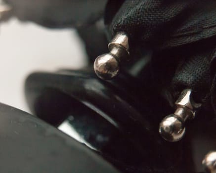 close up of metal tips on a black closed umbrella; UK