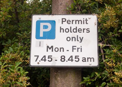 close up of permit holders only parking sign; UK