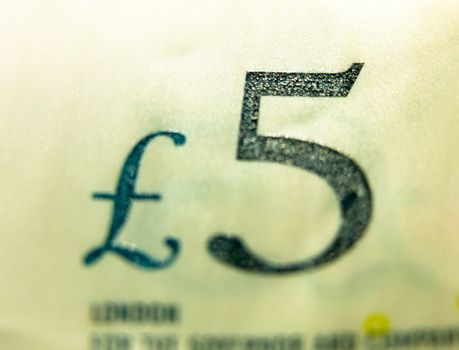 close up selective focus of five pound note £5; UK