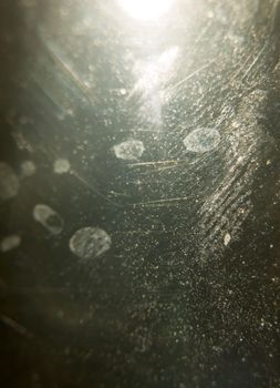 unique scratched and stained glass texture with light behind; UK