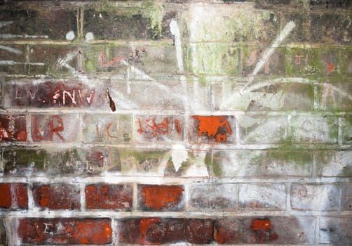 wall scratched and etched into inside tunnel; UK