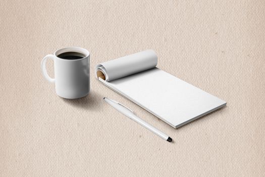 notebook with pen and coffee Cup on the surface.