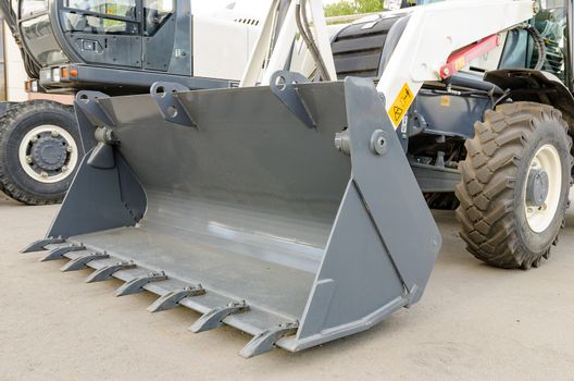New road-construction equipment outdoors on the exhibition