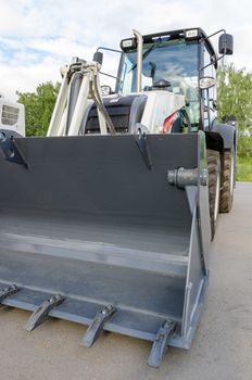 New road-construction equipment outdoors on the exhibition