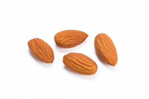 Almonds isolated on white background, shallow DOF