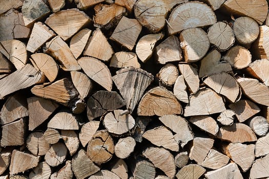 Pile of wood logs ready for winter - landscape exterior