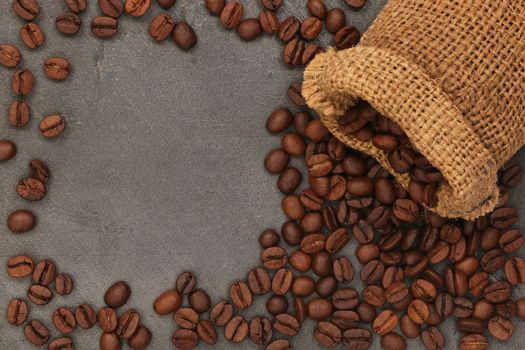 coffee beans and bag on old rusty background