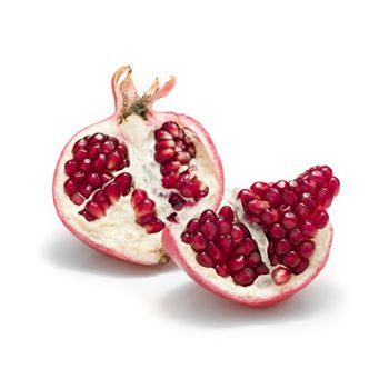 ripe pomegranate seeds isolated over white background
