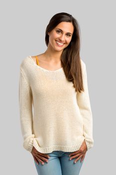 Studio shot of a beautiful young woman smiling