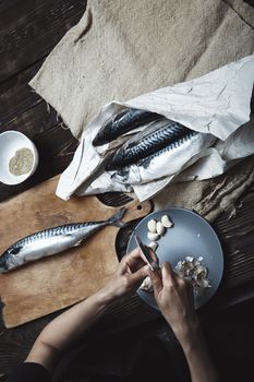 Woman preparing fish