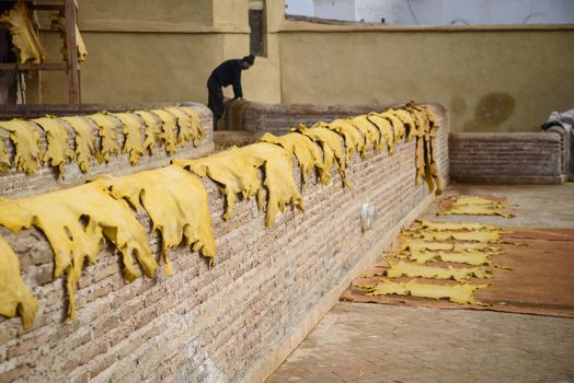 Tannery in the middle of souk in Fez, Morocco. Traditional leather tannery from the 11th century is now biggest tourits attraction in Fes.