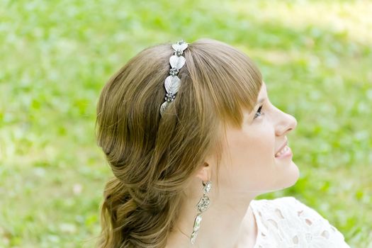 Profile of bride with diadem in the summer time