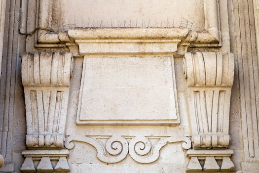 Detail of old house in baroque style in Italy