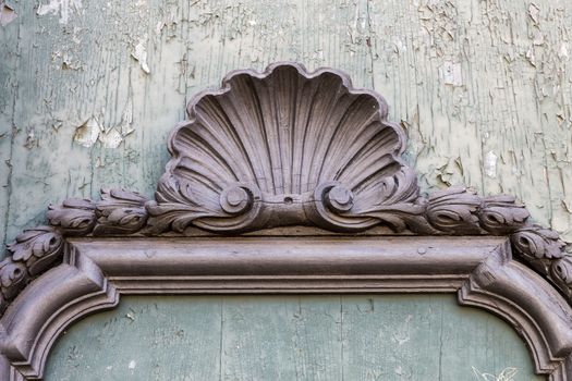 Detail of old house in baroque style in Italy