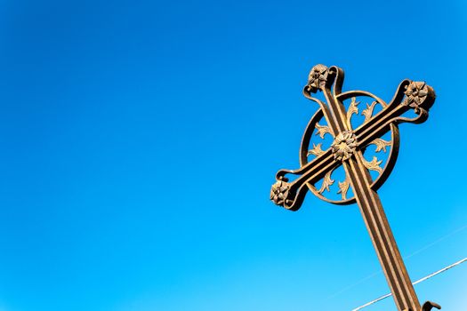 An ancient iron cross on the sky