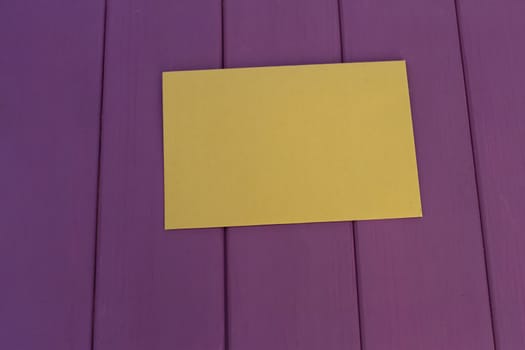 kraft paper envelope on a purple wooden background. Vintage style.