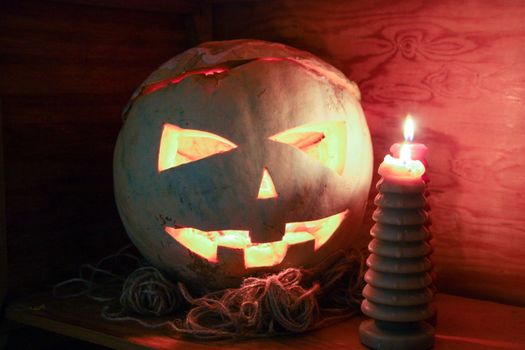 Halloween concept. Fiery pumpkin. Scary and scary. Photo horizontal for your design.