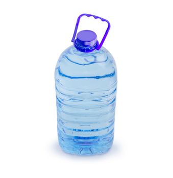 Drinking water in the blue large transparent plastic bottle with carrying handle on a white background
