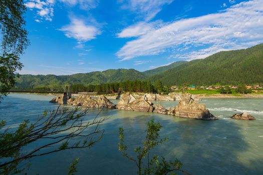 Fast mountain river Katun in Altay, Siberia, Russia. A popular tourist place called the Dragon's Teeth