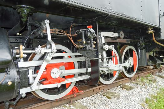 Mechanism of an old steam locomotive on a railway in the Austrian Tyrol