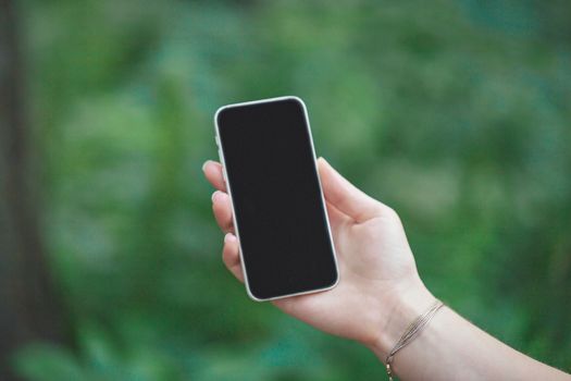 Close up of smart phone in girl's hand