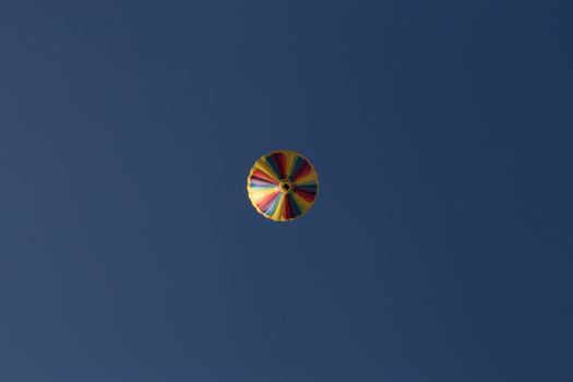 Hot air balloon, photographed against the blue cloudless sky