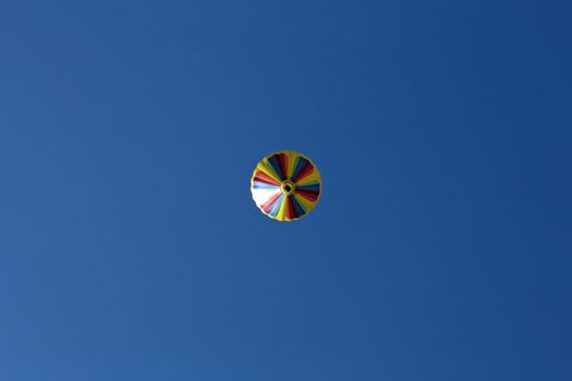 Hot air balloon, photographed against the blue cloudless sky