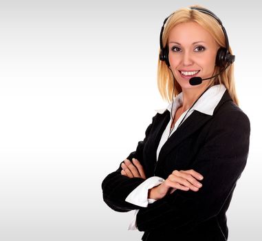 Pretty business woman with a headset against a grey background with copyspace