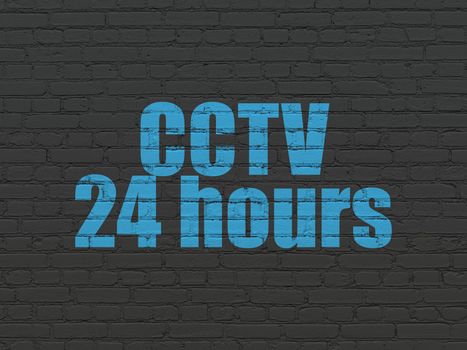 Protection concept: Painted blue text CCTV 24 hours on Black Brick wall background