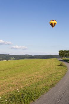 Hot air balloon, photographed against the blue cloudless sky