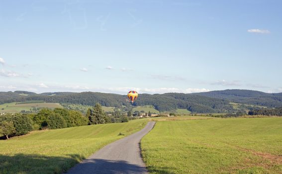 Hot air balloon, photographed against the blue cloudless sky