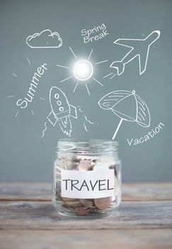 Jar of travel savings with sketches against a chalkboard 