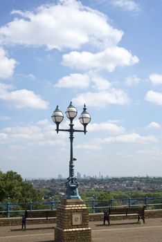 antique street light with a beautiful view of london city