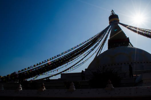 the famous buuha eye gazing out sleepily from each side of the tower are those of the all seeing primordial buddha.perched a top a hill on the western edge of the kathmandu valley.