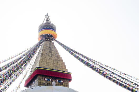 the famous buuha eye gazing out sleepily from each side of the tower are those of the all seeing primordial buddha.perched a top a hill on the western edge of the kathmandu valley.