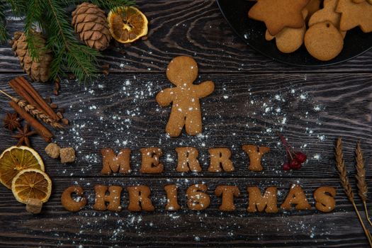 Gingerbreads for new years and christmas on wooden background, xmas theme