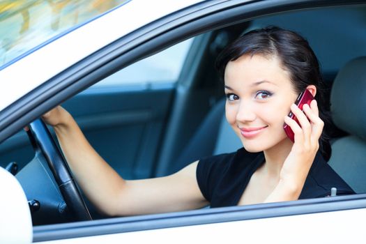 Woman driver using a mobile telephone