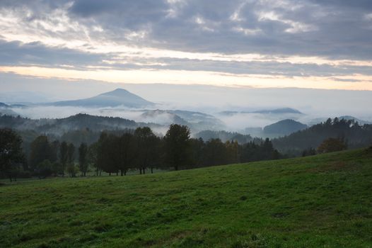 Early evening landscape with fog in Czech Switzerland